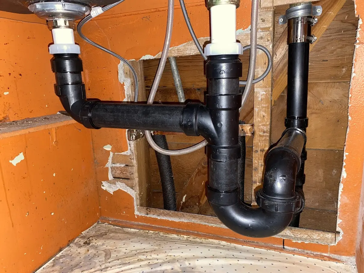 Professional Garbage Disposal Repair equipment and tools on the job in Brecknock